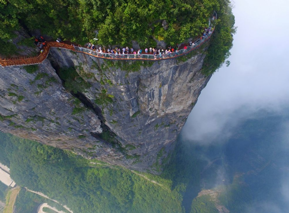 People walk on a sightseeing platform in Zhangjiajie, Hunan Province, China