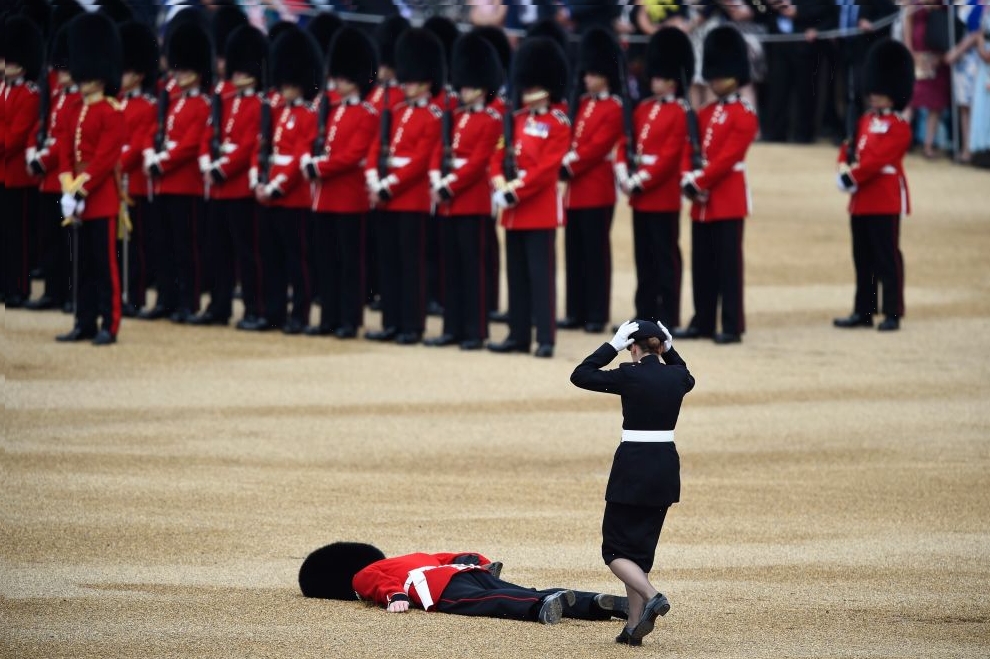 A Guardsman faints at Horseguards Parade for the annual Trooping the Colour ceremony in central London