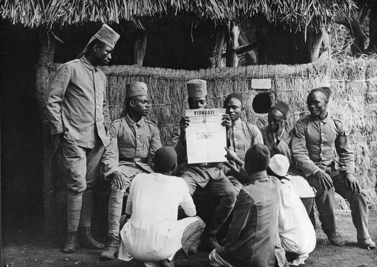Local soldiers in German East Africa (modern day Rwanda) gather to read a newspaper with an update of the outbreak of WWI. Most of the war took place in Europe of course, but some operations took place in Africa. Outnumbered and rarely resupplied, German colonies fought a guerilla war to try and bog down mainly British troops in Africa. As with British territories in Africa as well, the locals within the colonies were often conscripted and fought. Northern African colonies would even fight in Europe, but soldiers such as these fought locally. Some of the German regiments even remained at large right up until the end of the war, unable to be destroyed or captured by the larger and better equipped British units after them.