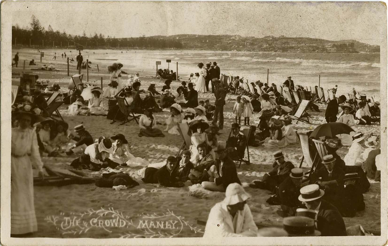 People enjoy a day at the beach in Manly, Australia in 1890. I don't know why it appears no one is in the water, but as you can see, everyone is very overly dressed for what most of us would consider the beach. Not a single elbow, knee, shoulder, or back is showing on any of the beachgoers. The ones sitting in the sand don't even have anything underneath them, getting sand all in their proper clothing. This image was used for a postcard to advertise Manly. If anyone was swimming, it would be in full body suits, also barely showing limbs and not much skin outside of hands, feet, and the head, as was common for the time period.