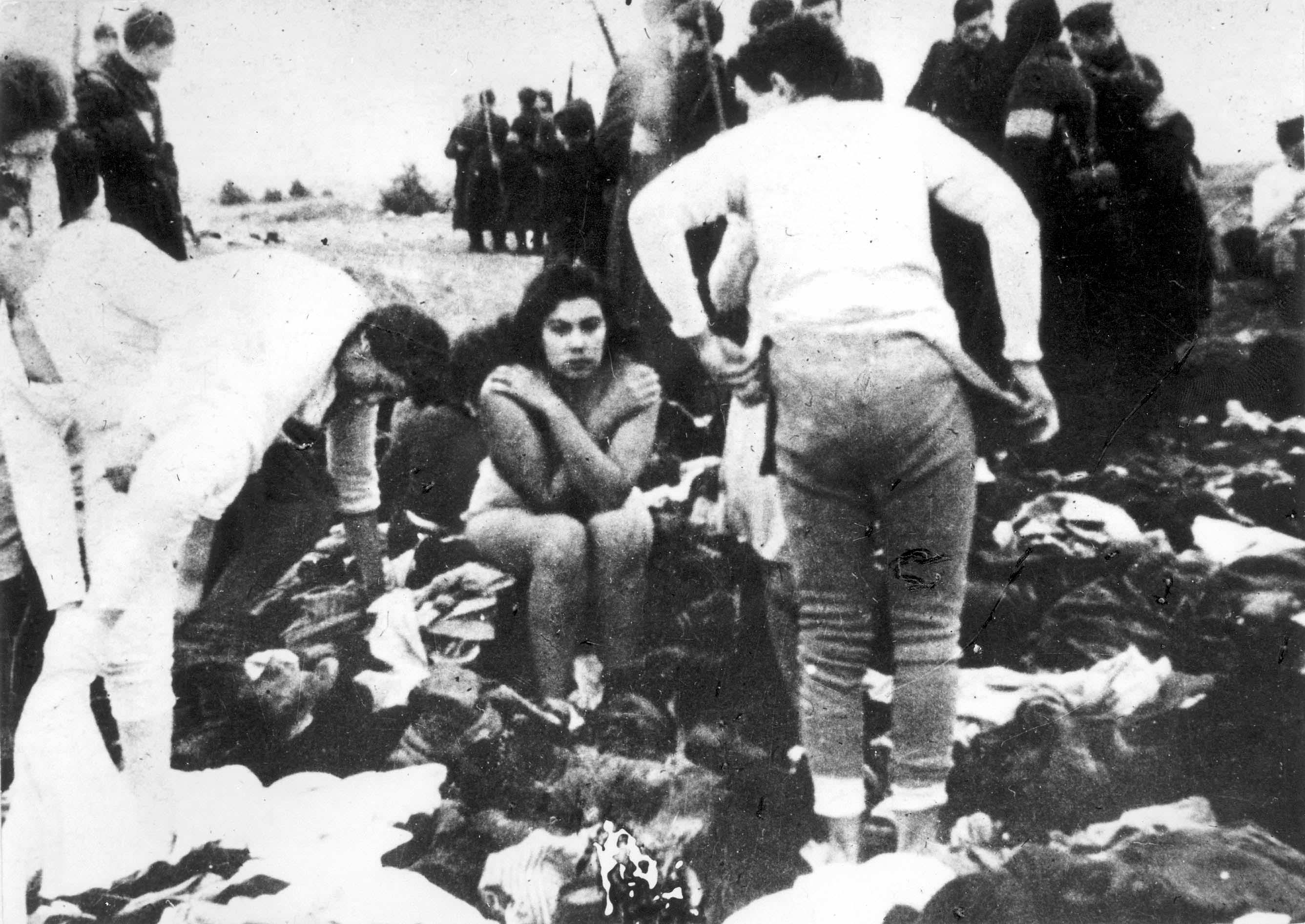 Continuing from the previous picture, a teenage girl sits frozen in fear as the other women around her strip their clothes off in Latvia in 1941. Moments later, the women would be led to a ditch nearby and shot. Everyone in this picture knew they were about to die. Nearly 3,000 Jews were killed in 3 days, almost all women and children. The SS orchestrated the executions rather than deportation. Throughout WWII, hundreds of thousands of Jews along with other undesirables such as gypsies, cripples, and special needs people were shot rather than gassed, especially early in the war as countries fell to the Third Reich. Part of the reason they would move to the Final Solution and have Jews and others gassed instead was not only because it was faster and far more efficient, but it was also less traumatic to their soldiers. Many soldiers, even SS divisions, proved they still had part of their humanity as they were having a lot of trouble shooting women and children.
