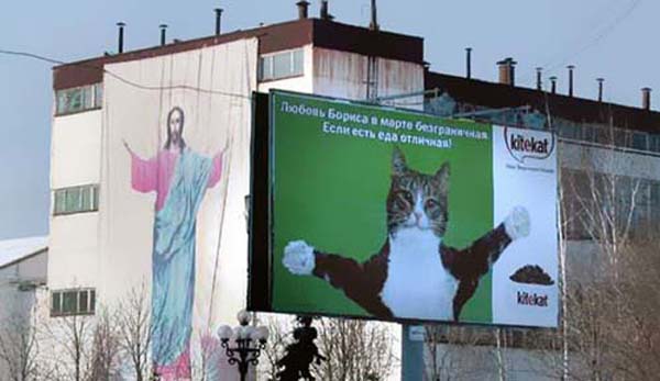 Ah yes. The welcoming arms of Jesus... and his cat.
