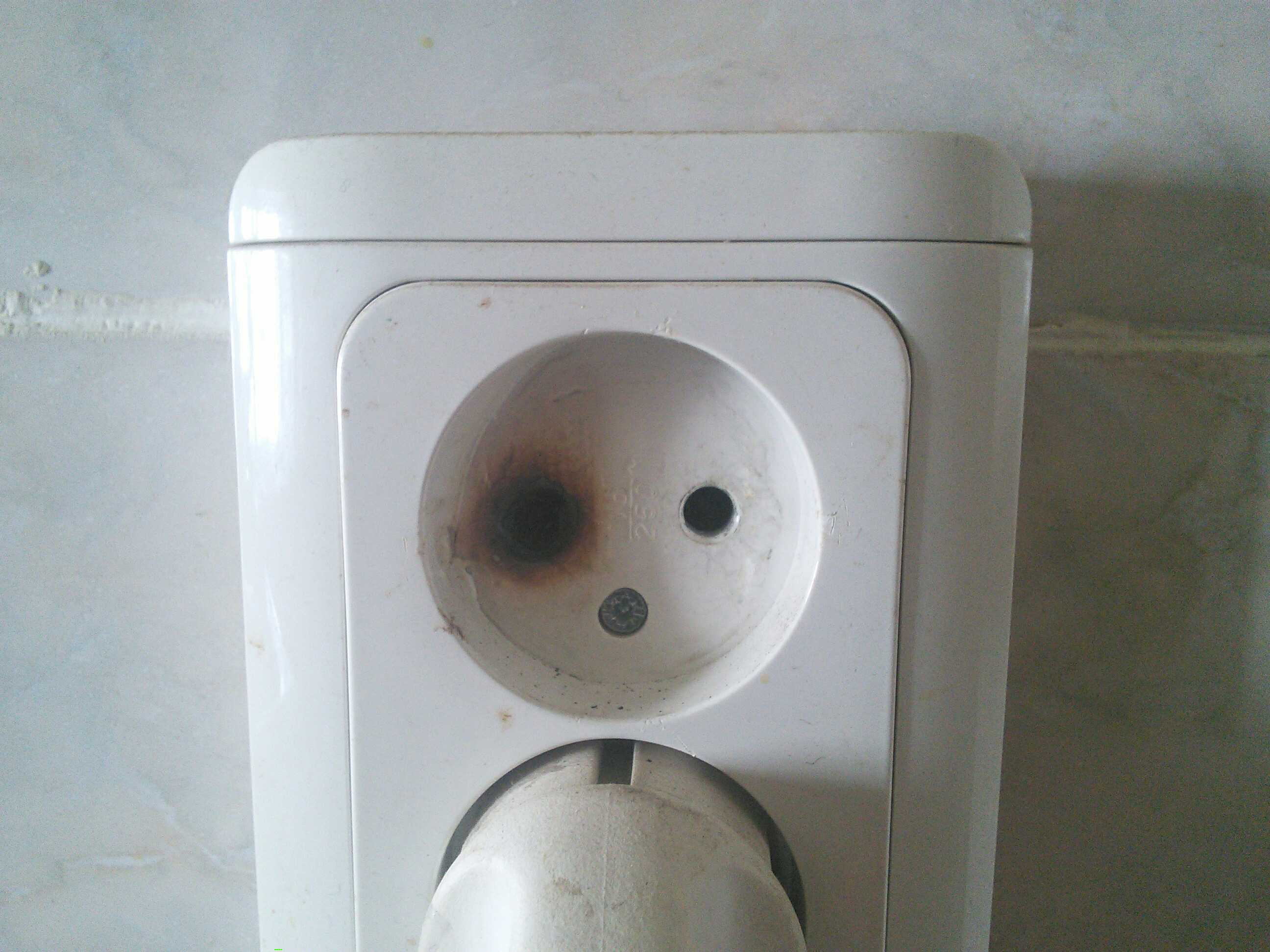 This electrical outlet looks like someone who got into a fight.