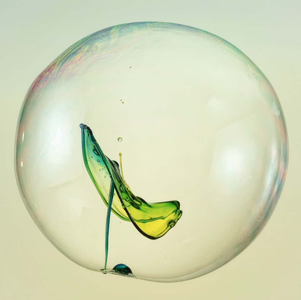 German artist Markus Reugels uses colored water to create different shapes and forms, such as this bubble, which he photographed using a high-speed camera to capture the millisecond in which a splash occurred inside.