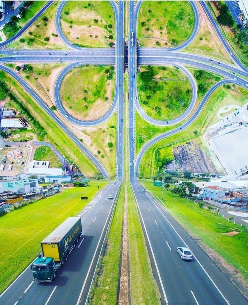 This image is something that boggles the mind. Captured by a drone hovering over a cloverleaf intersection in an unknown location, the effect is rather mind-bending.