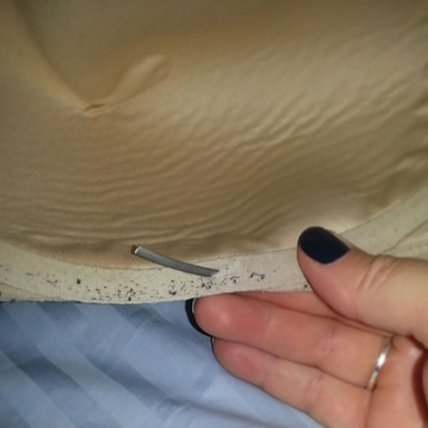 Just seeing this underwire poking out literally makes you feel the pain of a broken bra: