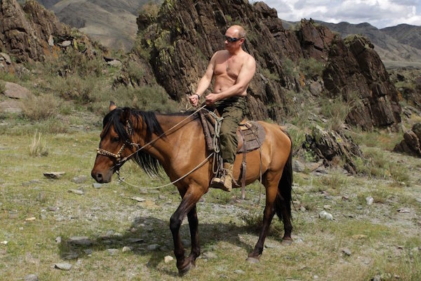 Putin isn’t afraid to show a little skin while riding a horse over a mountain.