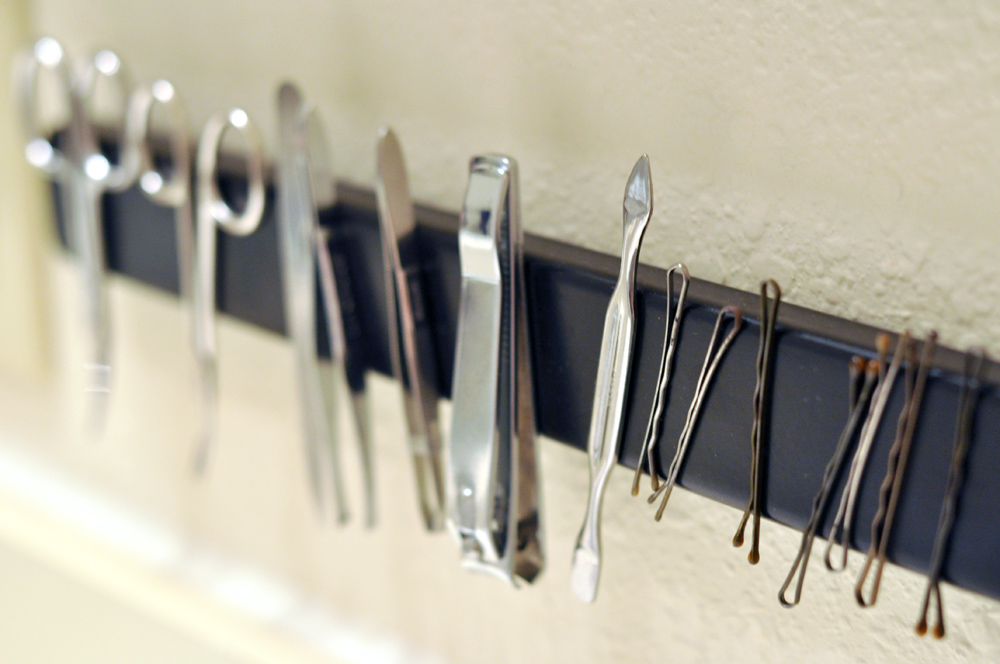 Use a magnetic strip to organize all your metal beauty products