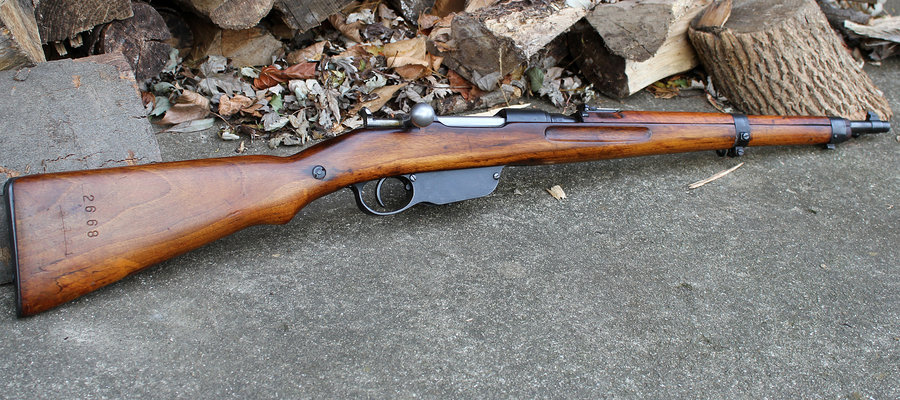 Mannlicher M1895 (Austria-Hungary):

One of the lesser known, but widely used bolt-action rifles of WWII is the Mannlicher M1895. Originally adopted in 1895 by Austria-Hungary, the M1895 remained in frontline service through the end of the war. The M1895 is unusual in that it utilized a straight-pull bolt actionrather than the more common rotating bolt-handle of the other rifles featured here. From 1895-1945 approximately 3.5 million of these rifles were produced with around 6,000 rifles converted to sniper rifles from 1915-1918. The rifle was in military and police service all over Europe with around 20 nations officially fielding the rifle in that time.