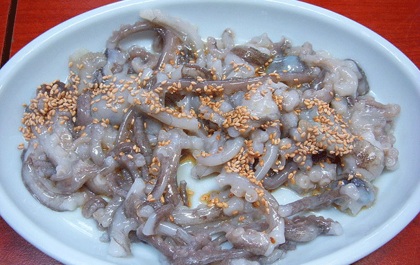 Sannakji: Like many eastern foods, this one is served raw. Very raw. Just watch as the chef dismembers a small octopus before your eyes and seasons the pieces with sesame oil, if he can hit them that is, because many times they are still moving on the plate as you reach for your chopsticks.