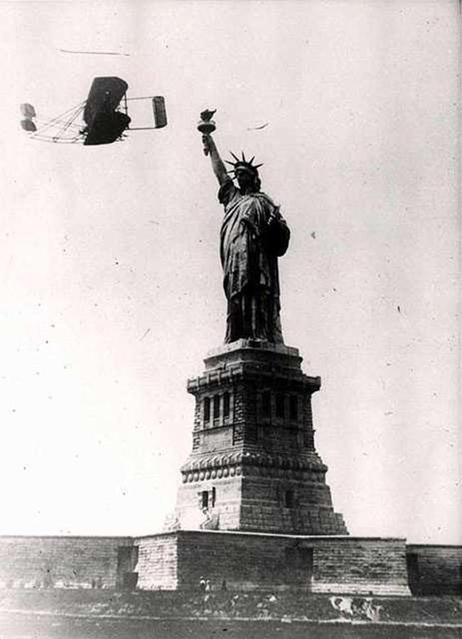 1909 - Wilbur Wright flies around the Statue of Liberty.