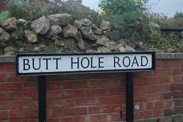 Butt Hole Road is the former name of a street in the town of Conisbrough, Doncaster, England. I know its not a town name but its still a funny sign
