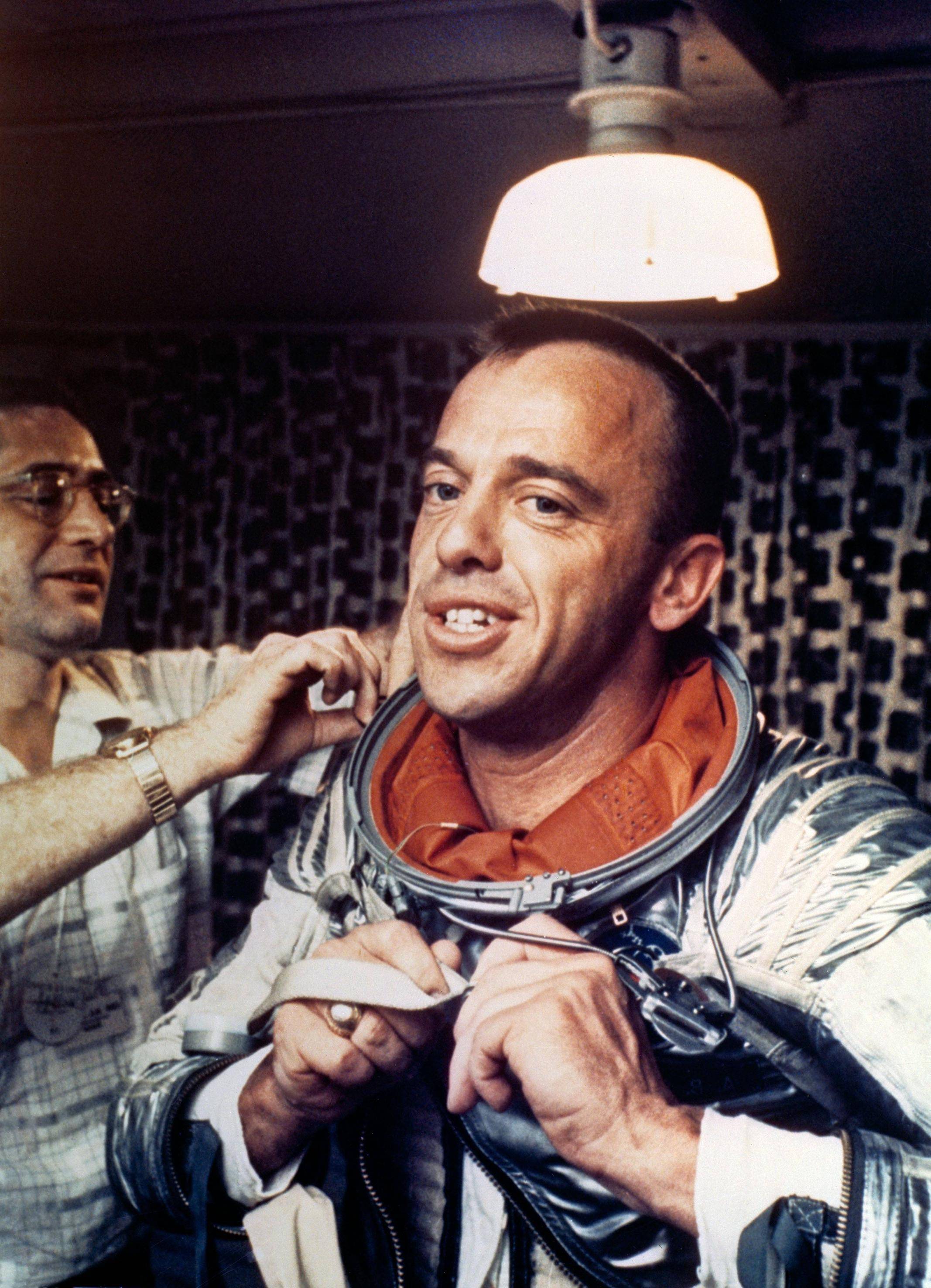 Alan Shepard, Americas First Man in Space Puts on his Navy Mark IV Spacesuit