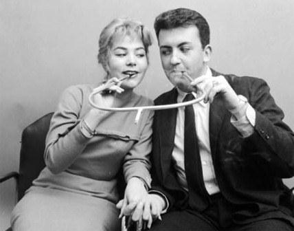 Cigarette Sharing Device: Nothing says I love you like sharing a cigarette together.
