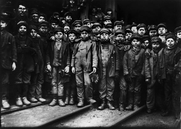 This is a photograph of breaker boys  child labor used to separate coal from slate. This image helped lead the nation to outlaw child labor. The photo was taken by Lewis Hine who traveled the United States taking photographs of child laborers.