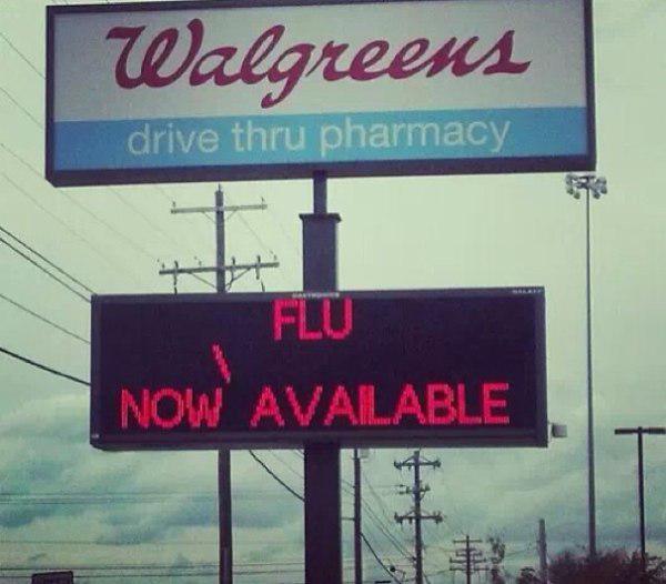 street sign - Walgreens drive thru pharmacy Flu Now Available