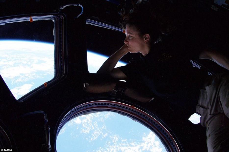 Tracy Caldwell looks down on Earth from the International Space Station