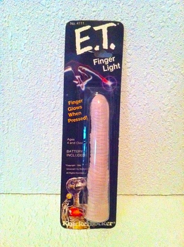 No. 4111 E.T. Finger Light Finger Glows When Pressed! Ages 4 and Over Battery Included Beker