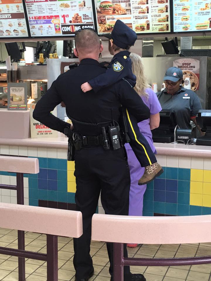 Cop Picks Up This Little Girl And Waits For Order, But When They Turn...