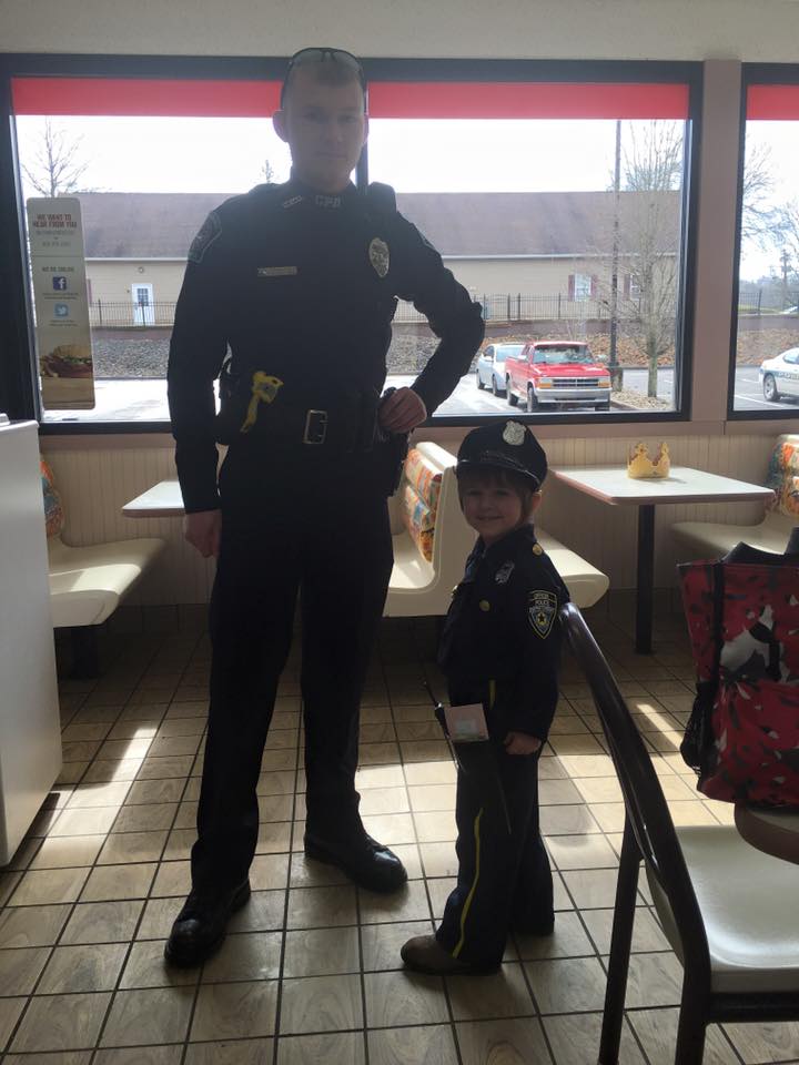 Cop Picks Up This Little Girl And Waits For Order, But When They Turn...