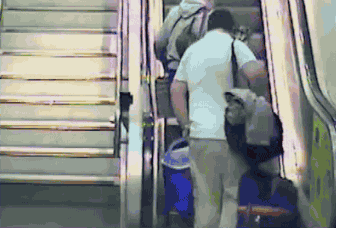 escalator fall gif