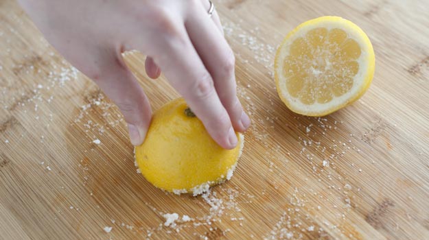 Cutting boards:
Dish soap doesn't quite cut it when it comes to cutting boards. Wooden cutting boards, especially, can trap food debris in their nicks and cuts, so it's important to do a thorough job. Halve a lemon and grab some kosher salt to rub along the board to dislodge the particles. Then, wash with soap and water.