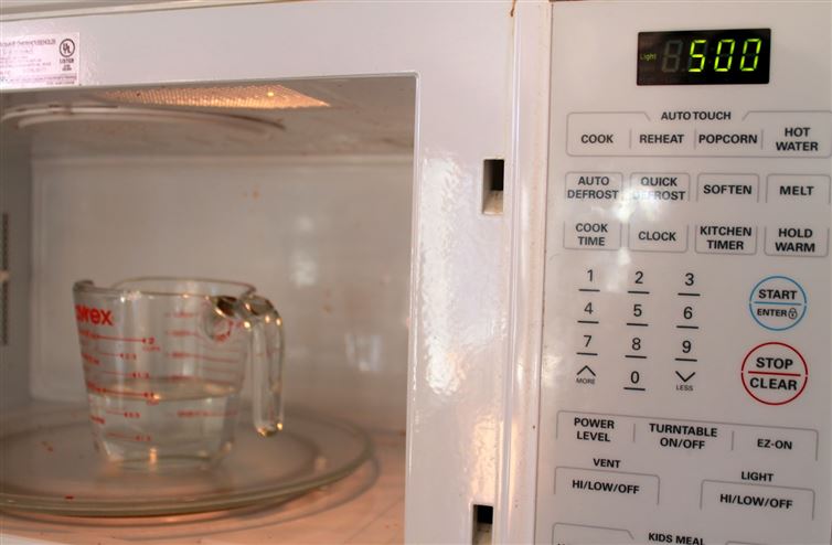 Microwave:
Stop wasting energy scrubbing away at the nuked-on bits of food in your microwave. Instead, fill a bowl with water and vinegar and microwave on high for at least two minutes. Your microwave will get delightfully steamy and all you'll have to do is wipe away the grime.