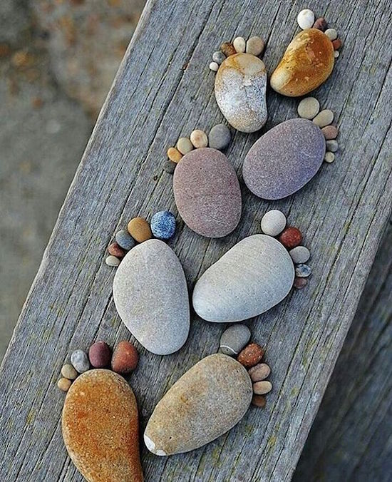 rocks shaped into feet with toes
