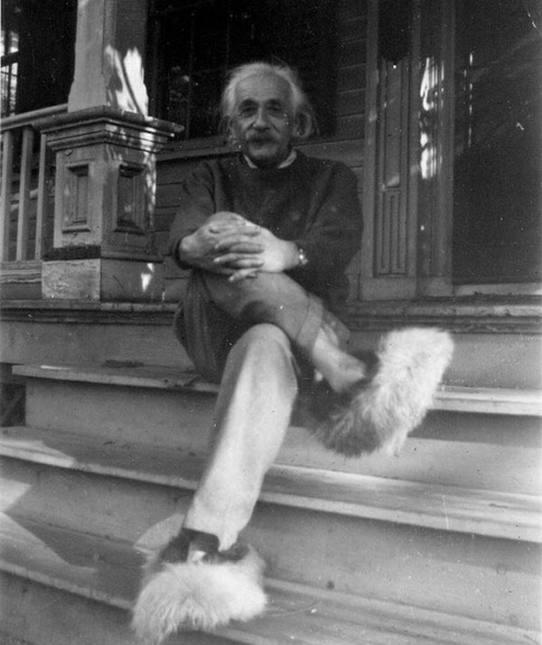 Albert Einstein wearing fuzzy slippers