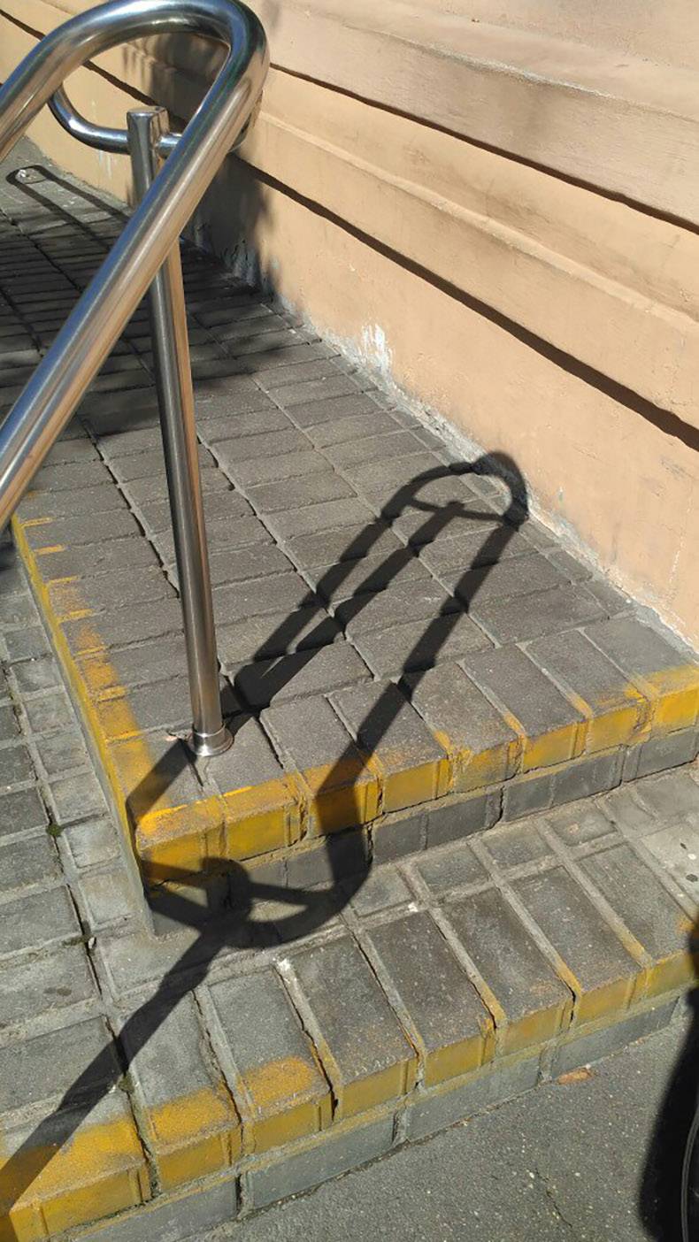 wtf hand railing that has a shadow like a penis drawing