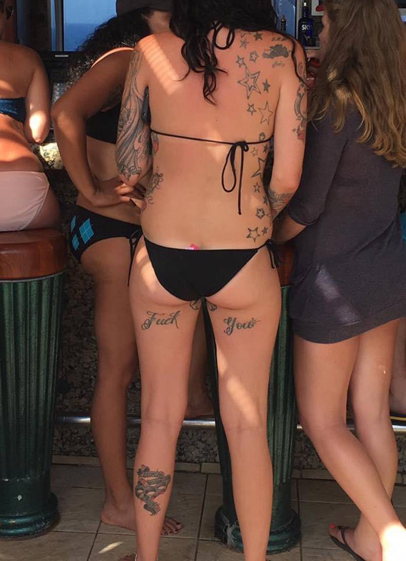 Woman in bikini with crass tattoos