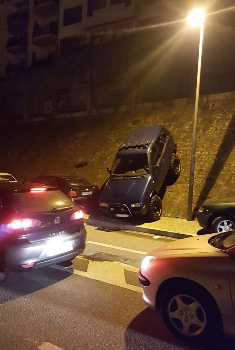 Parking an SUV on a very inclined wall.