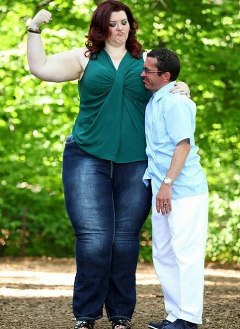 Very large and tall woman near a man of small stature.
