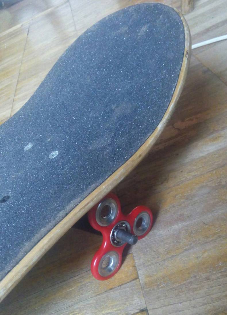Skateboard with a fidget spinner for wheels