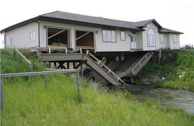 Massive mobile home that collapsed the bridge it was crossing so now it is a house bridge.