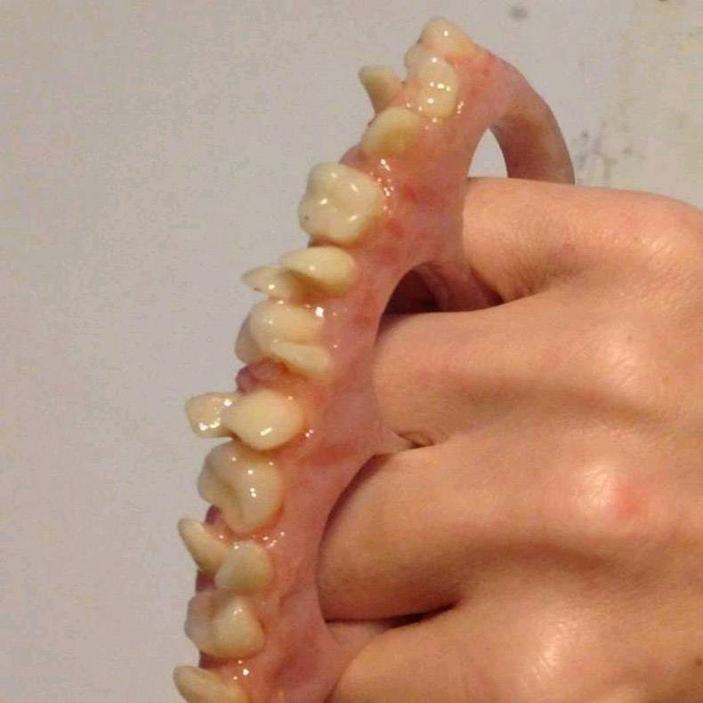 random pic teeth brass knuckles