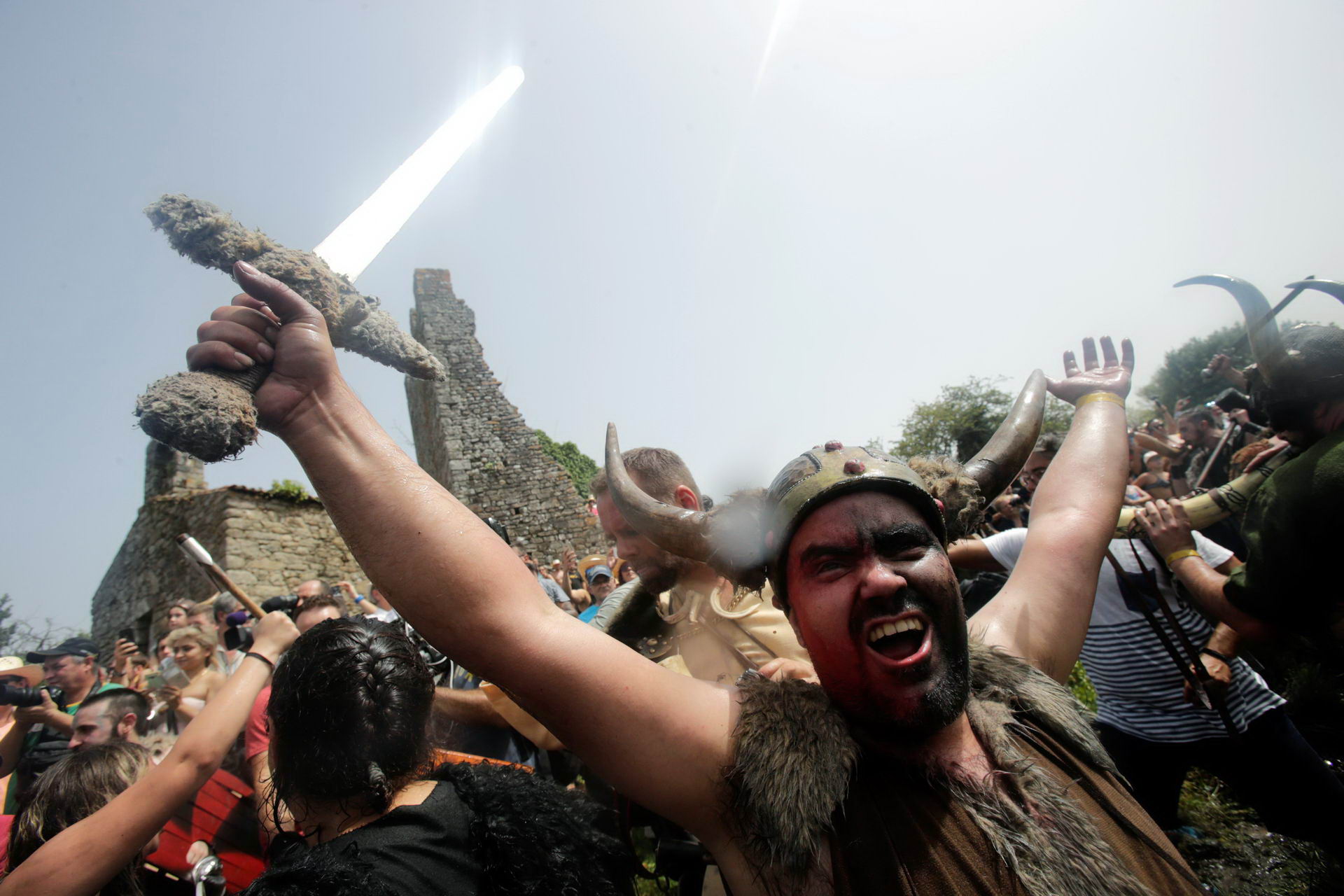 During the 58th Viking Festival in Catoira, Spain, people dressed as Vikings and villagers re-enact the Viking invasion of Galicia's coast. The residents participate in the historical defeat of King Ulfo's Viking invaders by Bishops Cresconio's troops.