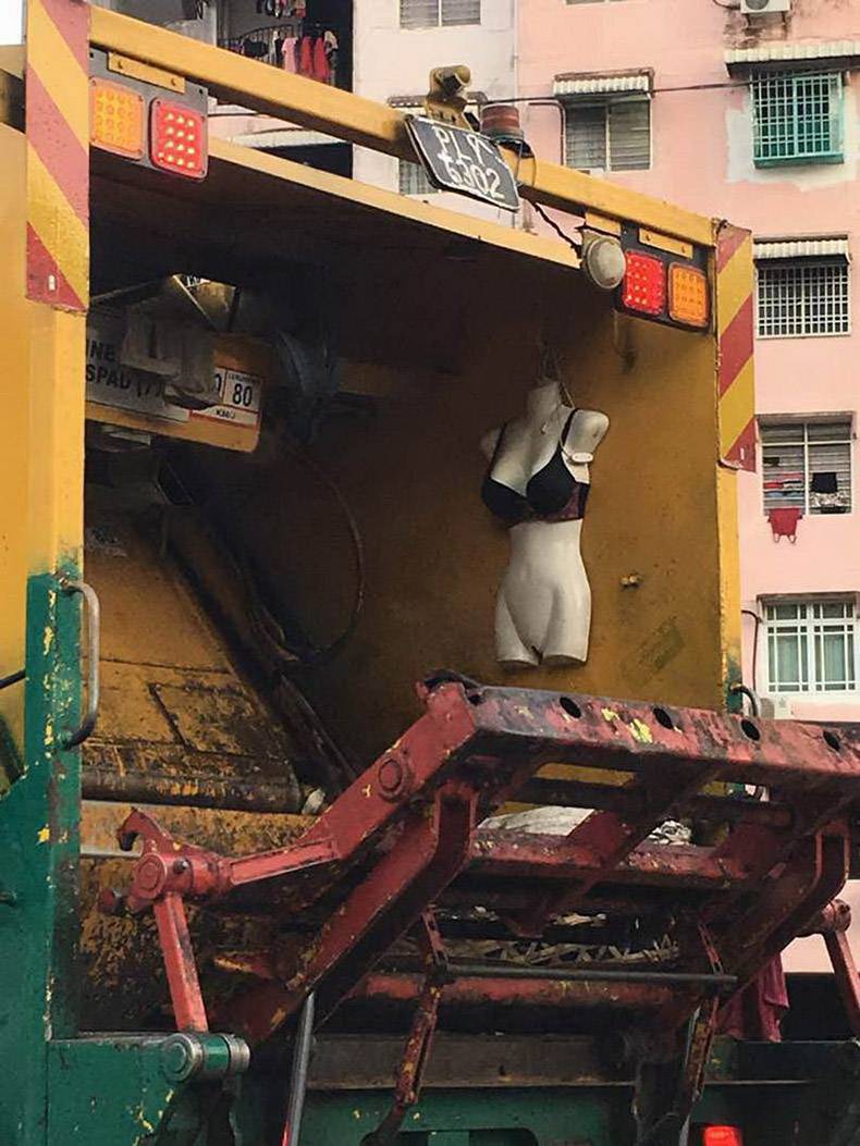 mannequin in a garbage truck