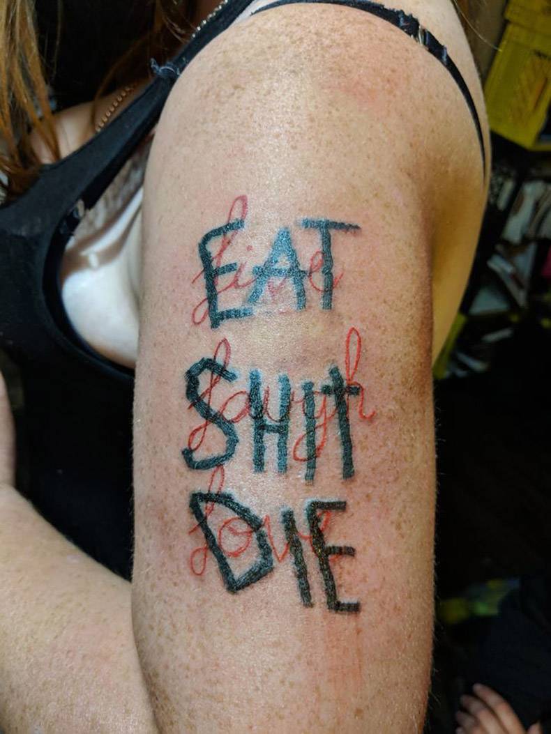 eat shit die tattoo over a more wholesome 3 word tattoo