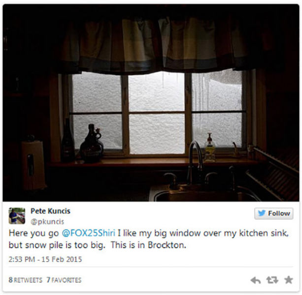 The snow drifts are so high that people cannot see out of their windows.