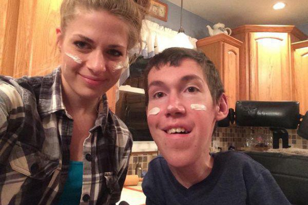 This is 22 year old Shane Burcaw.  He has a disease called Spinal Muscular Atrophy that will eventually end his life.  And that lovely lady on the left?  Contrary to popular public belief, that's not his family member or his nurse.  It's his girlfriend, Anna.