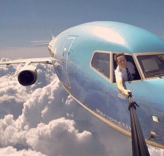 DeviantArt is behind this obviously Photoshoped, but hilarious image of a pilot taking a selfie from outside his plane.
