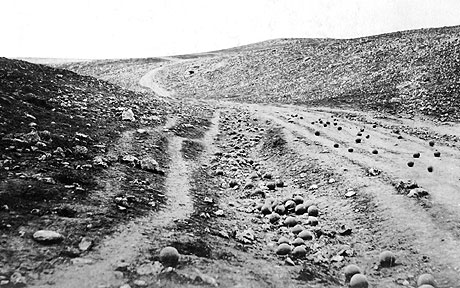 1855, Valley of the Shadow of Death (by Roger Fenton). Fenton is widely regarded as the first war photographer. Unable to take pictures of battle due to the necessary exposure time needed to create a photograph in the 1850s, Fenton arranged cannon balls across a barren landscape. This metaphorical and eerily empty image demonstrated that the photograph could be as thoughtful and affecting as a poem, even on the battlefield.