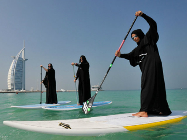 Paddle Board Surfing in an Abaya
