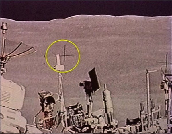 The Layered Cross-hairs

The cameras used by astronauts during the moon landings had a multitude of cross-hairs to aid with scaling and direction. These are imprinted over the top of all photographs. Some of the images, however, clearly show the cross-hairs behind objects in the scene, implying that photographs may have been edited or doctored after being taken. The photograph shown above is not an isolated occurrence. Many objects are shown to be in front of the cross-hairs, including the American flag in one picture and the lunar rover in another.