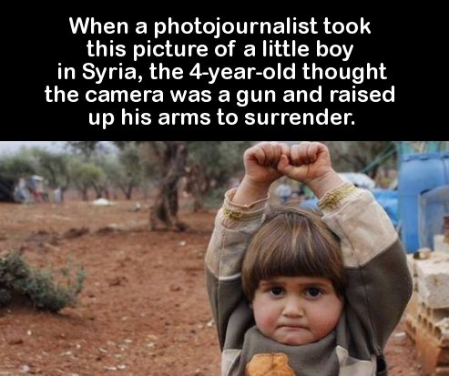 When a photojournalist took this picture of a little boy in Syria, the 4yearold thought the camera was a gun and raised up his arms to surrender.