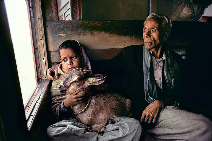 Morning commute on a train in India (they look so sad)