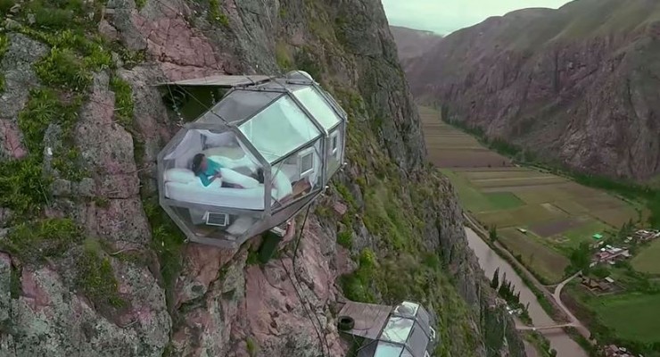 A sleeping capsule on the side of a cliff- omg how cool