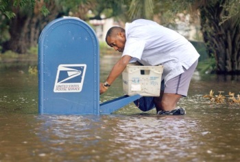 funny picture of USPS mailman in flood
