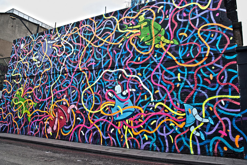 Awesome street art of a multitude of lines and people on them.